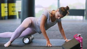 Woman using foam roller on muscles video