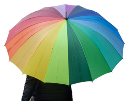 femme tenant avec un parapluie multicolore sous la pluie png