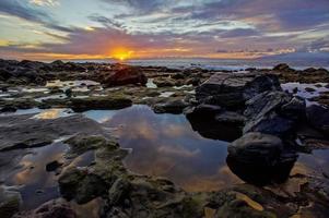 Sunset over the ocean photo