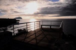 Sunrise Pier over the ocean photo