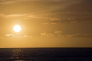 Sunset over the ocean photo