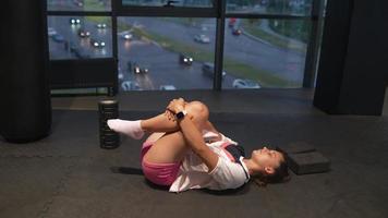 Woman stretching in gym video