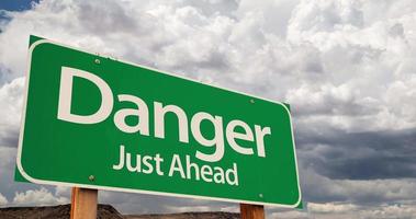 4K Time lapse Danger Green Road Sign and Stormy Cumulus Clouds and Rain. video