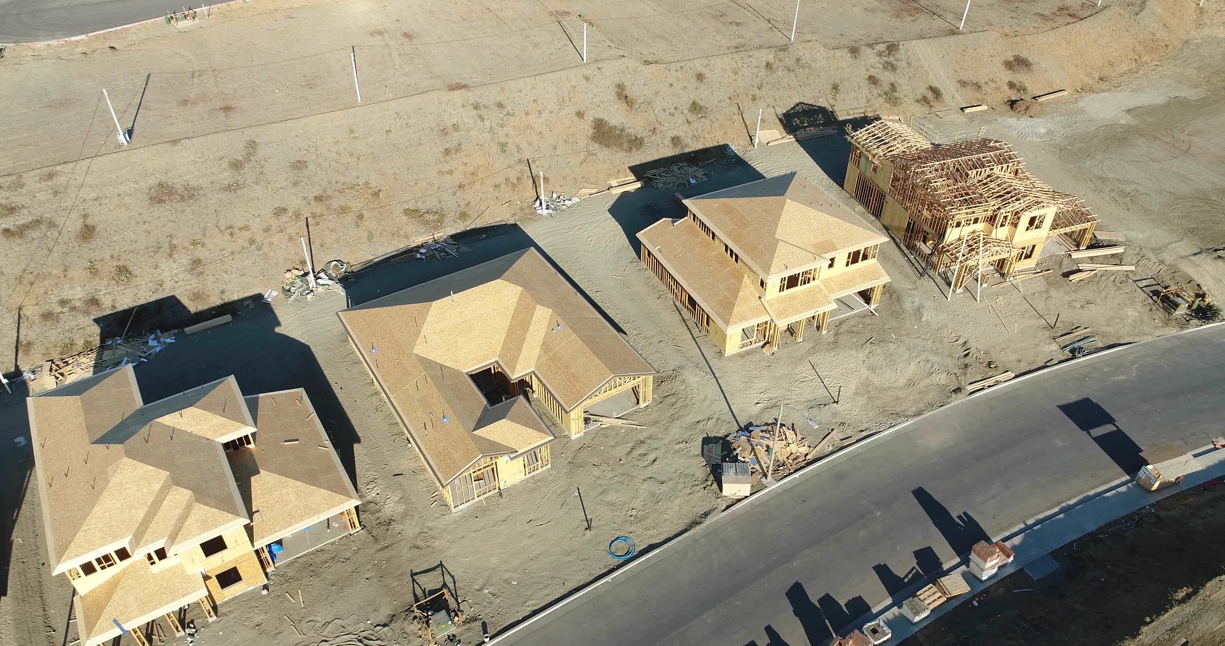 High Definition 4k Pan Down Over New Home Construction Sites. 15740579