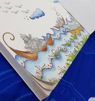 A coloring book for adults, with a doodle of a ship. Very cute and beautiful. photo