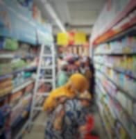 This is a blur photo of a supermarket or mall storefront