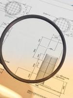 A magnifying glass is often used to view and magnify detailed shop drawings photo