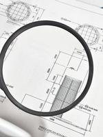 A magnifying glass is often used to view and magnify detailed shop drawings photo