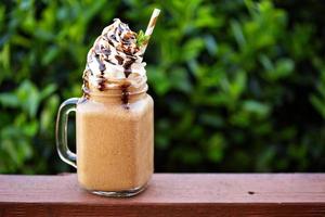 Chocolate frappe coffee with whipped cream outside photo