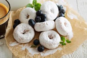 Small donuts in powdered sugar photo