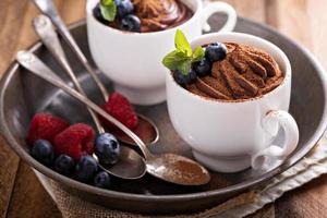 Chocolate pudding with cocoa and berries photo