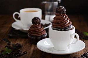 Gourmet chocolate cupcakes with a candy on top photo