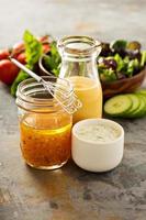 Variety of sauces and salad dressings photo