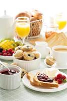 Fresh and bright continental breakfast table photo