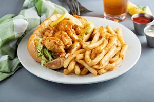 Po boy sandwich with fried shrimp photo