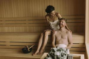 Young couple relaxing in the sauna photo