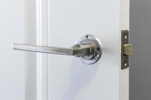 Installation of a door handle, closeup shot photo