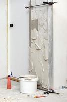 Wall with fresh plaster on it. Home apartment renovation process photo