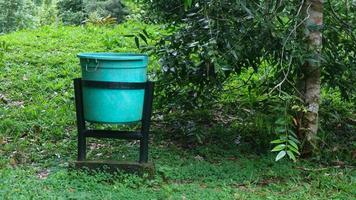 green trash can in tourist spot photo