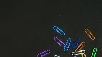 Paper clip isolated on a black background photo