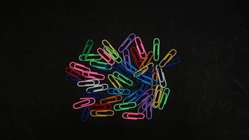 Paper clip isolated on a black background photo