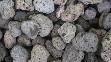 Detailed surface texture of a pile of pumice as a background photo