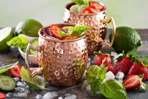 Moscow mule cocktail with lime and strawberry photo