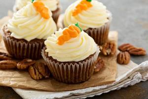 Carrot cupcakes with cream cheese frosting photo