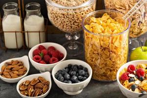 Cereal bar or buffet wih cornflakes, fruit and nuts photo