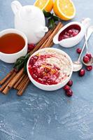 Fall breakfast with oatmeal and cranberry sauce photo