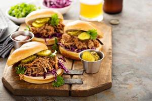 Pulled pork sandwiches with cabbage and pickles photo