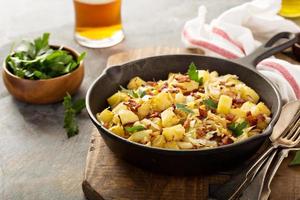 Fall side dish with fried cabbage, potatoes and bacon photo