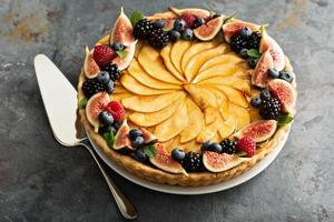 French apple tart decorated with berry photo