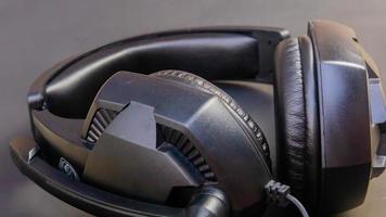 black headset isolated black background photo