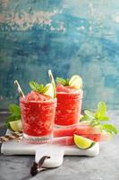 Watermelon slushie cocktail with lime photo