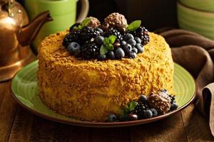 Honey layered cake with berries photo