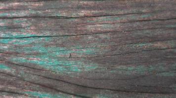 wood texture with faded paint as background photo