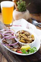 Gyro plate with meat on a pita photo