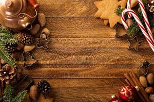 Christmas background with nuts, spices and pine tree photo