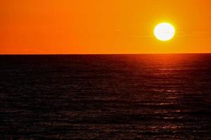 Sunset over the sea photo