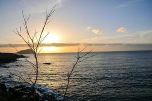 Sunset over the ocean photo