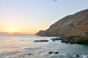 Sunset over the ocean photo