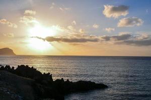 Sunset over the ocean photo