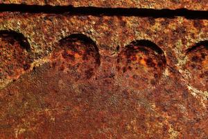 Detailed close up surface of rusty metal and steel with lots of corrosion in high resolution photo