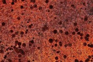 Detailed close up surface of rusty metal and steel with lots of corrosion in high resolution photo