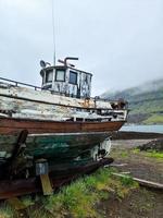 An old abandoned boat on the coast of Iceland. photo