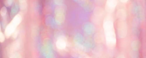 Light pink glitter background defocus light. Blurred pink background with defocus. photo