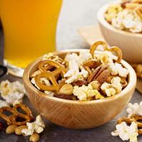 Homemade salty trail mix with beer photo