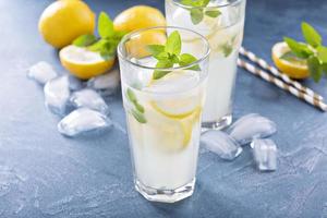 Classic lemonade on blue background photo