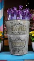 Violet candy bar in a tin can bucket at flower shop. photo